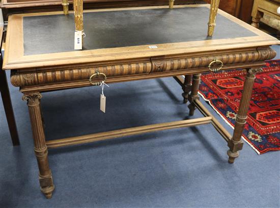 A French walnut writing table, W.120cm